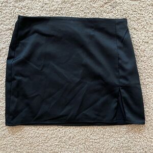 Black mini skirt with slit